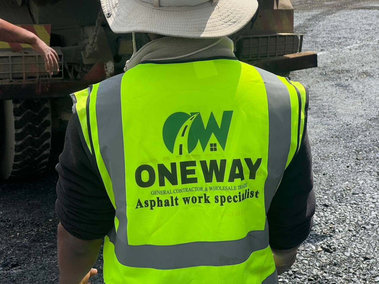 One Way crew on site, branded safety vest